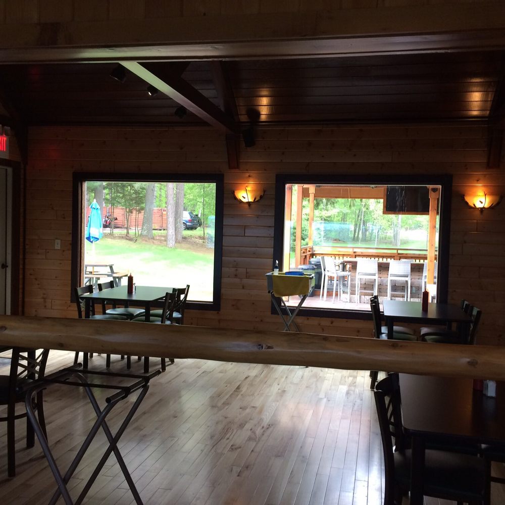 a view of a dining room with tables and chairs a view of a dining room with tables and chairs