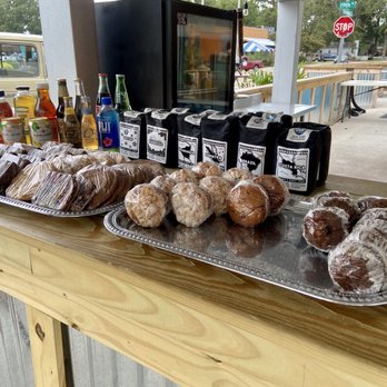 Java Surf Cafe & Espresso Bar - Java Surf Cafe & Espresso Bar - outdoor ordering area with baked treats and bags of coffee - Breakfast & Brunch Near Me - Virginia Beach, Virginia
