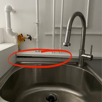 Punch Remodeling - This was glued in place unevenly, can't even adjust it ourselves‍ - General Contractors Near Me - Morton Grove, Illinois