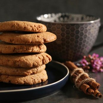 Nagen Vegan Bakery - a stack of cookies and a cup of coffee - Desserts Near Me Nagen Vegan Bakery - a stack of cookies and a cup of coffee - Desserts Near Me