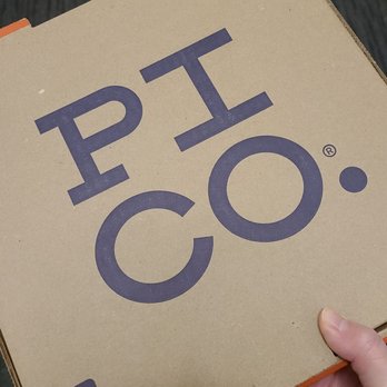 PI CO. - a person holding a pico box - Pizza Near Me - Toronto, Ontario