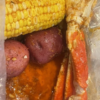 Crab Du Jour - Crab legs with sauce and potatoes and corn - Seafood Near Me - Charlotte, North Carolina Crab Du Jour - Crab legs with sauce and potatoes and corn - Seafood Near Me - Charlotte, North Carolina
