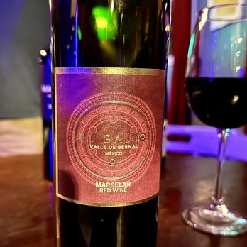 The Post Beer and Wine Garden - a bottle of wine and a glass of wine - Wine Bars Near Me - Houston, Texas The Post Beer and Wine Garden - a bottle of wine and a glass of wine - Wine Bars Near Me - Houston, Texas