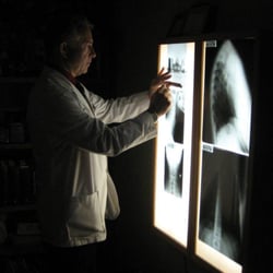 Engler Chiropractic Health Center - Doc analyzing xrays
