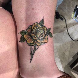 I got a yellow rose as a memorial to my great uncle. Tiffany gave it a lovely "real but not real" quality. I got a yellow rose as a memorial to my great uncle. Tiffany gave it a lovely "real but not real" quality.