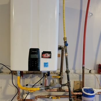 Penguin Home Services - Tankless water heater system installed with code-compliant gas, venting, and filtration connections. - Plumbing Near Me - Boulder, Colorado Penguin Home Services - Tankless water heater system installed with code-compliant gas, venting, and filtration connections. - Plumbing Near Me - Boulder, Colorado