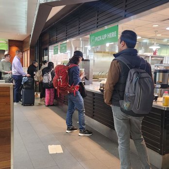 Shake Shack - people standing in line at the counter - Burgers Near Me - Queens, New York