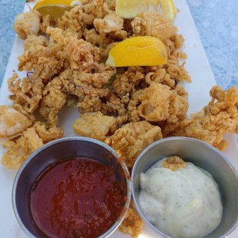 Quinn's Lighthouse - Plate 2 of Monterey Deep Fried Calamari with tartar and spicy red cocktail sauce. - Seafood Near Me - Oakland, California Quinn's Lighthouse - Plate 2 of Monterey Deep Fried Calamari with tartar and spicy red cocktail sauce. - Seafood Near Me - Oakland, California