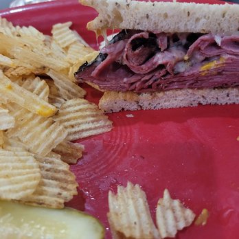 Catering By Scott - Half eaten hot pastrami & swiss on rye. - Delis Near Me - Columbus, Ohio Catering By Scott - Half eaten hot pastrami & swiss on rye. - Delis Near Me - Columbus, Ohio