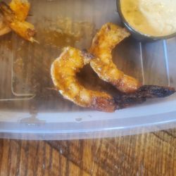 What's left of the shrimp on the BBQ