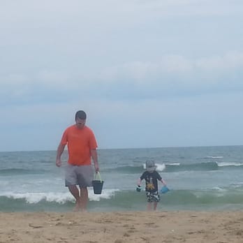 Chad's Dad's BBQ - a father and son playing on the beach - Food Trucks Near Me Chad's Dad's BBQ - a father and son playing on the beach - Food Trucks Near Me