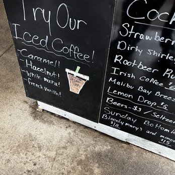 Double D Diner - Selection of Iced Coffee menu - A black chalkboard sign promotes iced coffee flavors like caramel, hazelnut, and French vanilla outside a business. - Diners Near Me - Davenport, Iowa