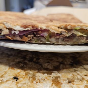 Milano’s Pizza - There is very little of anything inside this wedgie and the dough is thin. - Pizza Near Me - Evans City, Pennsylvania Milano’s Pizza - There is very little of anything inside this wedgie and the dough is thin. - Pizza Near Me - Evans City, Pennsylvania