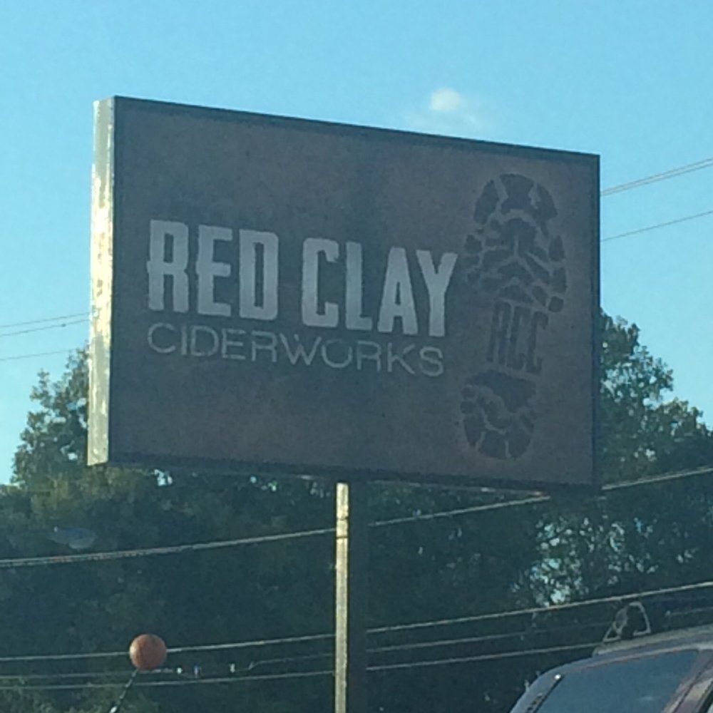 Red Clay Ciderworks - Sign in the front of what used to be an English furniture store. - Cideries Near Me - Charlotte, North Carolina Red Clay Ciderworks - Sign in the front of what used to be an English furniture store. - Cideries Near Me - Charlotte, North Carolina