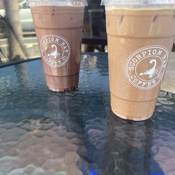 Scorpion Bay Coffee - Iced coffee mocha on the left and a iced coffee Mexican mocha on the right - Coffee & Tea Near Me - Pismo Beach, California Scorpion Bay Coffee - Iced coffee mocha on the left and a iced coffee Mexican mocha on the right - Coffee & Tea Near Me - Pismo Beach, California