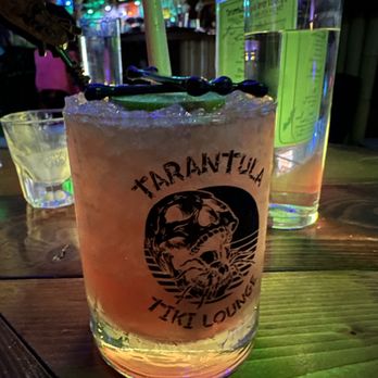 Tarantula Tiki Lounge - Love their logo glassware! All drinks are made to order here. - Cocktail Bars Near Me - Fort Worth, Texas Tarantula Tiki Lounge - Love their logo glassware! All drinks are made to order here. - Cocktail Bars Near Me - Fort Worth, Texas
