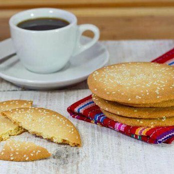 Panadería & Restaurante Guatemalteca Dennis - a stack of cookies and a cup of coffee - Latin American Near Me - Dallas, Texas Panadería & Restaurante Guatemalteca Dennis - a stack of cookies and a cup of coffee - Latin American Near Me - Dallas, Texas
