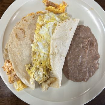 Mundy's Tamale' & Grill - Two tacos (chorizo & egg and potato & egg tacos with a side of refried beans. - Breakfast & Brunch Near Me - Pharr, Texas Mundy's Tamale' & Grill - Two tacos (chorizo & egg and potato & egg tacos with a side of refried beans. - Breakfast & Brunch Near Me - Pharr, Texas