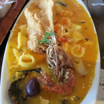 El Rocoto - Pescado a lo macho (Shrimp, squid, mussel, scallop and octopus with creamy aji amarillo sauce on fried fish fillet with rice) - Peruvian Near Me - Gardena, California El Rocoto - Pescado a lo macho (Shrimp, squid, mussel, scallop and octopus with creamy aji amarillo sauce on fried fish fillet with rice) - Peruvian Near Me - Gardena, California