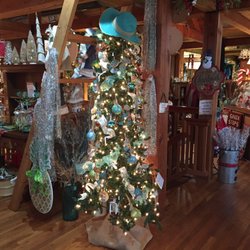 The Cotton Gin - A beach themed tree topped with a beach top. Very cute.