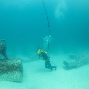 Neptune Memorial Reef - Hard had diver "Running" to help re-position the lions. - Funeral Services & Cemeteries Near Me - Miami, Florida Neptune Memorial Reef - Hard had diver "Running" to help re-position the lions. - Funeral Services & Cemeteries Near Me - Miami, Florida