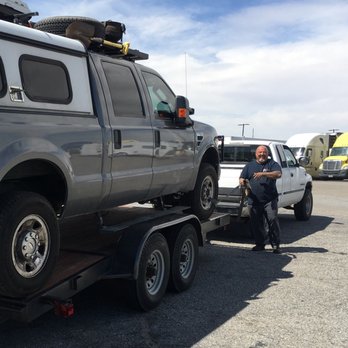 Serrato's Towing & Roadside Service - Tony Sr with my Truck on the Flatbed. He let me operate the switch!! Lol. These guys made a miserable experience bearable. - Roadside Assistance Near Me