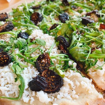 Kentro Greek Kitchen - a close up of a pizza - Greek Near Me - Fullerton, California