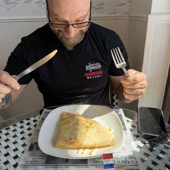 French Crêperie - My husband eating the crêpe - Creperies Near Me - Chesterfield, Missouri