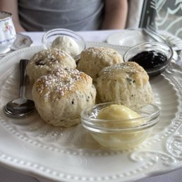 Scones, lemon curd, jam, and clotted cream