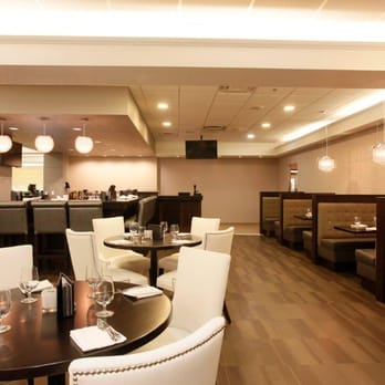 The Office - a dining area with tables and chairs - Canadian (New) Near Me - Grande Prairie, Alberta The Office - a dining area with tables and chairs - Canadian (New) Near Me - Grande Prairie, Alberta