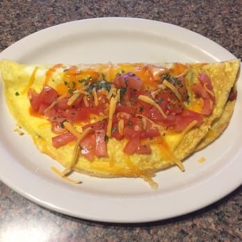 The Hungry Cowboy - an omelet on a plate - Cafes Near Me - Fort Laramie, Wyoming The Hungry Cowboy - an omelet on a plate - Cafes Near Me - Fort Laramie, Wyoming