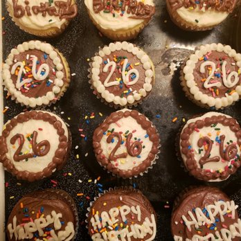 Crystal's Place Bakery - chocolate cupcakes with white frosting and sprinkles - Desserts Near Me