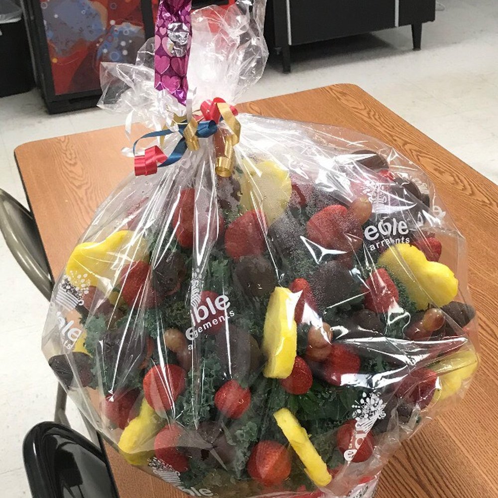 a bouquet of fruit and a balloon a bouquet of fruit and a balloon