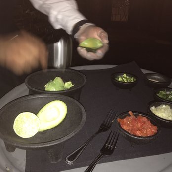 Cadillac Bar - Waiter making guacamole with fresh ingredients at our table - Tex-Mex Near Me - Houston, Texas Cadillac Bar - Waiter making guacamole with fresh ingredients at our table - Tex-Mex Near Me - Houston, Texas