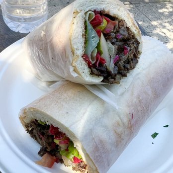 Falafel Hut - a burrito cut in half on a plate - Falafel Near Me - Montclair, New Jersey