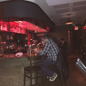 Pub Quartier Latin - a man sitting at a bar - Pubs Near Me - Montreal, Quebec Pub Quartier Latin - a man sitting at a bar - Pubs Near Me - Montreal, Quebec