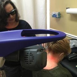 Family Chiropractic & Health Center - Margy using the MLS robotic laser on a patient with neck pain.