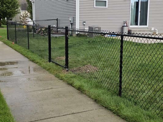 220 linear ft of vinyl coated chainlink - This job was 220ft of vinyl coated chainlink with 2- 4" walk gates turned out very nice! Customer was happy to not worry about his dogs running away anymore.