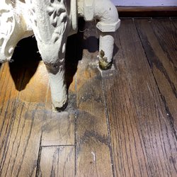 Hardwood Restoration Services - Gouge marks from the edge sander and the old stain under the radiator.