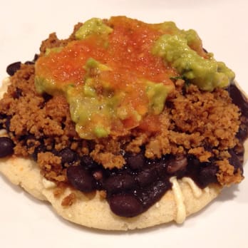 VSPOT - Arepa con todo: thick corn patty base with vegan mozzarella cheese, black beans, seitan carne molida, guacamole, and salsa. - Vegan Near Me - Brooklyn, New York VSPOT - Arepa con todo: thick corn patty base with vegan mozzarella cheese, black beans, seitan carne molida, guacamole, and salsa. - Vegan Near Me - Brooklyn, New York