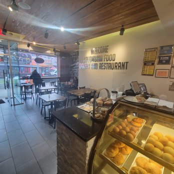 Que Rico Bakery And Restaurant - a man in the background - Cafes Near Me - Astoria, New York Que Rico Bakery And Restaurant - a man in the background - Cafes Near Me - Astoria, New York