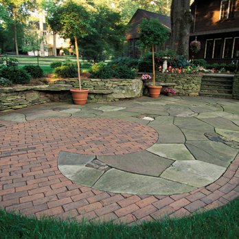 Perez Landscaping & Construction - a brick patio with a circular design - Landscaping Near Me - Lynn, Massachusetts