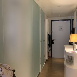 CitizenM Hotel - Entrance to room and enclosure on left of picture is the shower and washroom and on right is the sink and bar fridge