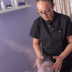 Sanar Aesthetics - Jenise giving a treatment.