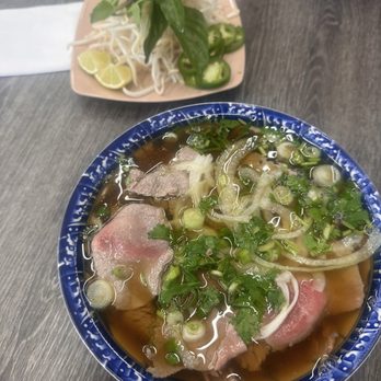 Pho Cafe - Dac Biet Pho and garnish - Vietnamese Near Me - Mukilteo, Washington Pho Cafe - Dac Biet Pho and garnish - Vietnamese Near Me - Mukilteo, Washington