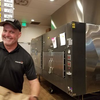 Mission BBQ - Ole hickory smokers and a smiling face behind the counter - Barbeque Near Me - Brandon, Florida