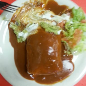 Papi's - Wet asada burrito. Meat beans and cheese inside. Smothered in sauce with a scoop of guac and sr cream - Mexican Near Me - Paso Robles, California Papi's - Wet asada burrito. Meat beans and cheese inside. Smothered in sauce with a scoop of guac and sr cream - Mexican Near Me - Paso Robles, California