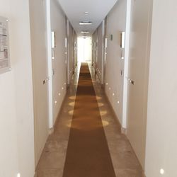 Meliá Villa Capri Hotel & Spa - Hall to pool with modern recessed entry doors lining the hall to guest rooms.