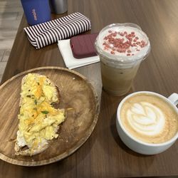 Eggs on toast, strawberry white mocha, and a caramel macchiato.