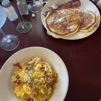 The Cenacle Bistro - Breakfast casserole bowl with scrambled eggs and bacon.  Pancakes with Turkey bacon. - Coffee & Tea Near Me - Austell, Georgia